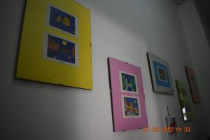 a group of pictures hanging on a wall at CASA VACANZE "A casa di Maria" in Naples