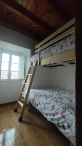 a bedroom with two bunk beds and a ladder at Eirixo in Valga +34 photos