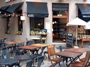 a group of tables and chairs in front of a restaurant at Corazón de Palermo Soho in Buenos Aires