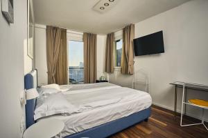 Voodi või voodid majutusasutuse Hotel Paradiso Conca d'Oro toas