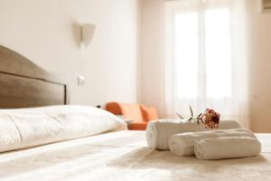 Postel nebo postele na pokoji v ubytování Hotel La Pace