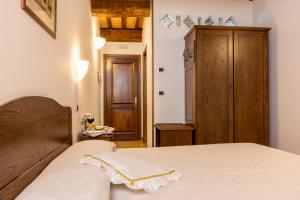 Postel nebo postele na pokoji v ubytování Hotel La Pace