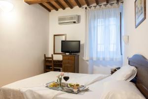 Postel nebo postele na pokoji v ubytování Hotel La Pace