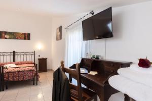 Postel nebo postele na pokoji v ubytování Hotel La Pace