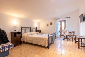 Postel nebo postele na pokoji v ubytování Hotel La Pace