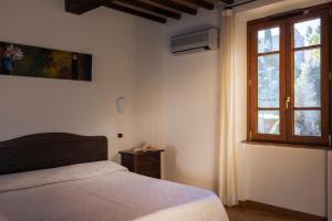 Postel nebo postele na pokoji v ubytování Hotel La Pace