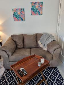 a living room with a couch with a coffee table at Bel Ti Plas in The Valley