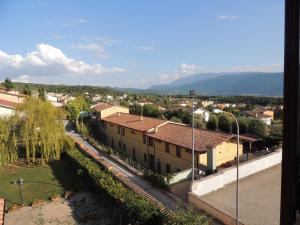 a view of a city with buildings and a street at Osteria Della Posta in Poggio Picenze