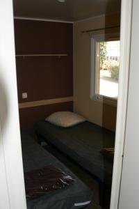 Säng eller sängar i ett rum på Domaine des Iscles 25