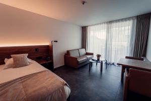 Postel nebo postele na pokoji v ubytování Casino Hotel
