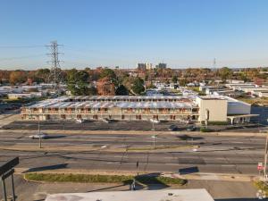 an empty parking lot with a large building at James River Inn & Suites in Newport News