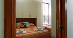 Ένα ή περισσότερα κρεβάτια σε δωμάτιο στο B&b Casa Bello