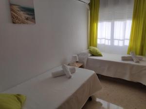 Postel nebo postele na pokoji v ubytování Victoria Home Córdoba