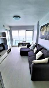 منطقة جلوس في Fantastico apartamento Faro de cullera a primera linea mar abierto playa de los olivos