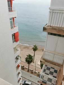 a view of the beach from a building at Beach front Esther 4 villajoyosa in Villajoyosa