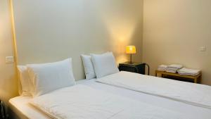 Un ou plusieurs lits dans un hébergement de l'établissement Anadia Chic Apartment