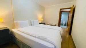 Un ou plusieurs lits dans un hébergement de l'établissement Anadia Chic Apartment