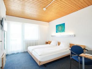En eller flere senge i et værelse på Erlebnisland Grizzlybär
