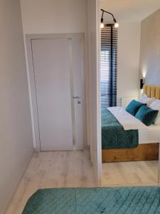 Posteľ alebo postele v izbe v ubytovaní Luksusowy apartament na Starym Miescie
