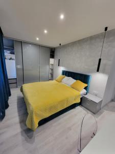 Posteľ alebo postele v izbe v ubytovaní Luksusowy apartament na Starym Miescie