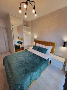 Posteľ alebo postele v izbe v ubytovaní Luksusowy apartament na Starym Miescie