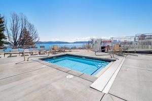 a swimming pool with a view of the water at Marina Retreat in Garden City