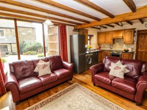 Kuchyň nebo kuchyňský kout v ubytování Midfeather Cottage + 24 fotografií