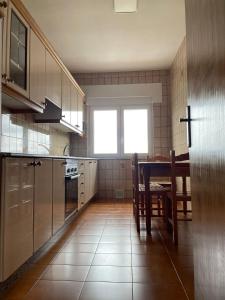 Kuchyň nebo kuchyňský kout v ubytování Apartamento Fin da terra