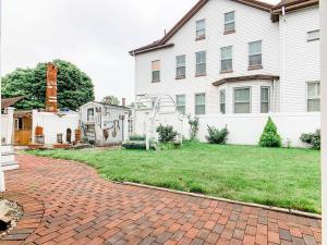 a house with a brick driveway in front of a yard at NEW! Family-Friendly Getaway -1 Mi to Dtwn Salem! in Salem