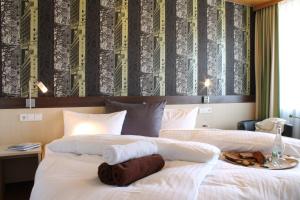 Postelja oz. postelje v sobi nastanitve Hotel-Landgasthof Brachfeld