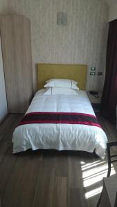Postel nebo postele na pokoji v ubytování Igiban Hotel