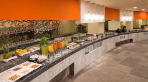 a buffet line with food and drinks on display at Camino Real Aeropuerto in Mexico City