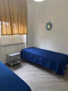 Postel nebo postele na pokoji v ubytování Casetta 2