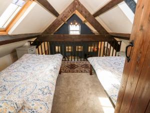Voodi või voodid majutusasutuse Bwthyn yr Helyg Willow Cottage toas