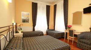 Voodi või voodid majutusasutuse Hotel Excelsior Splendide toas