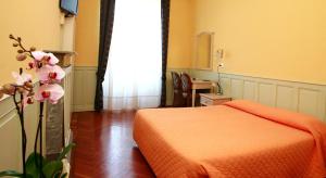 Voodi või voodid majutusasutuse Hotel Excelsior Splendide toas