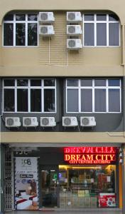 a building with air conditioners on top of it at Dream City in Kuching