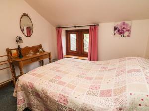 מיטה או מיטות בחדר ב-Elm Cottage