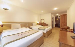 Rúm í herbergi á Vietsovpetro Hotel Dalat
