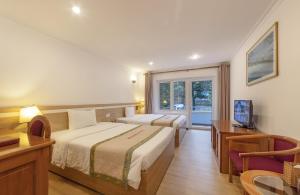 Rúm í herbergi á Vietsovpetro Hotel Dalat