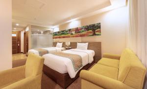Rúm í herbergi á Vietsovpetro Hotel Dalat