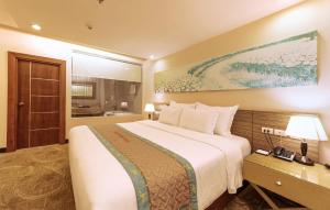 Rúm í herbergi á Vietsovpetro Hotel Dalat
