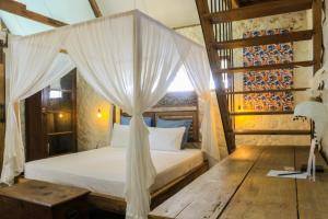 Postel nebo postele na pokoji v ubytování Chanteak Bali - Stone House 2