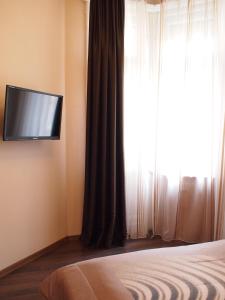 TV a/nebo společenská místnost v ubytování Budapest Suites