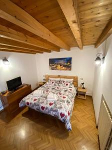 a bedroom with a bed and a flat screen tv at CABALDO in Ranica