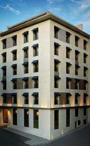 
a large building with a large window on the side of it at Witt Istanbul Suites in Istanbul
