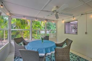 a dining room with a blue table and chairs at Vero Beach Oasis Less Than 7 Mi to South Beach Park! in Vero Beach