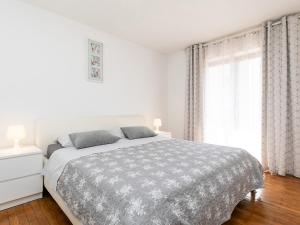 Postel nebo postele na pokoji v ubytování Apartments Nada