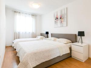 Postel nebo postele na pokoji v ubytování Apartments Nada