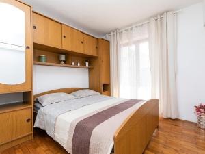 Postel nebo postele na pokoji v ubytování Apartments Nada